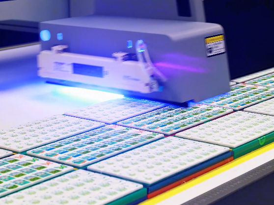 Printing carriage passing over rows of illustrated Mahjong tiles