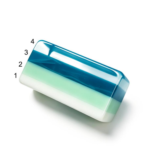 Four numbered layers in a white, pale green and teal acrylic Mahjong tile concept